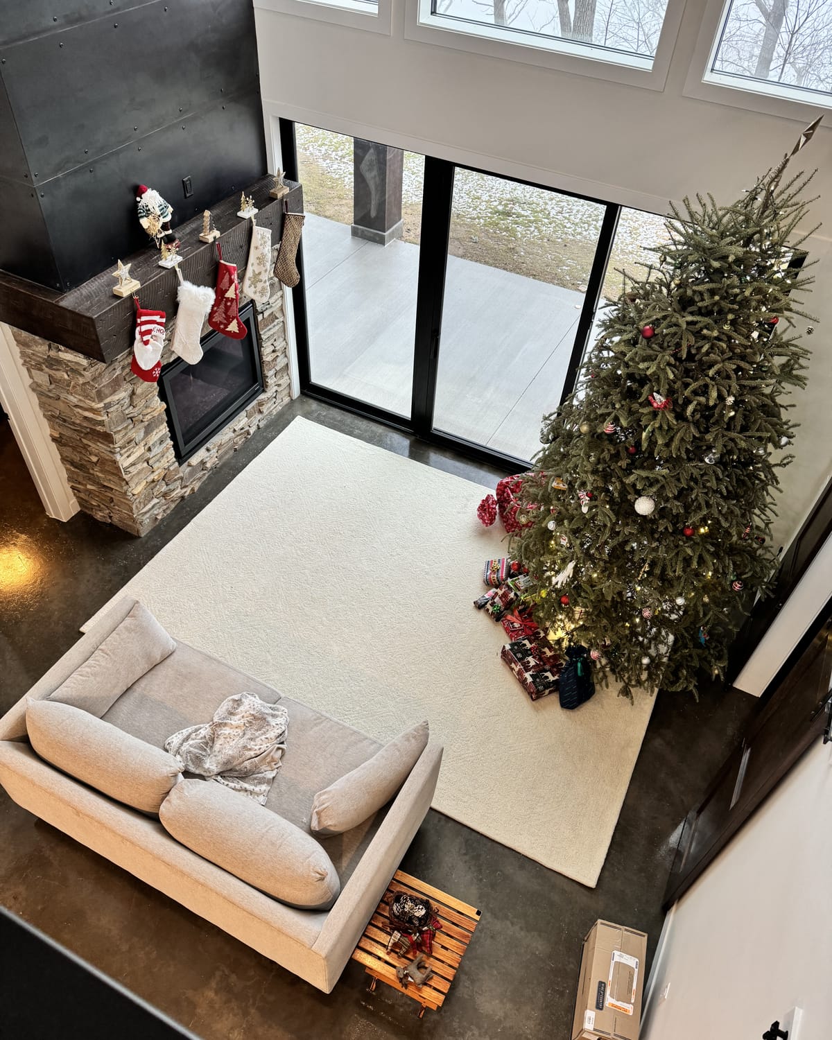 The fireplace, wrapped full height in blackened steel.