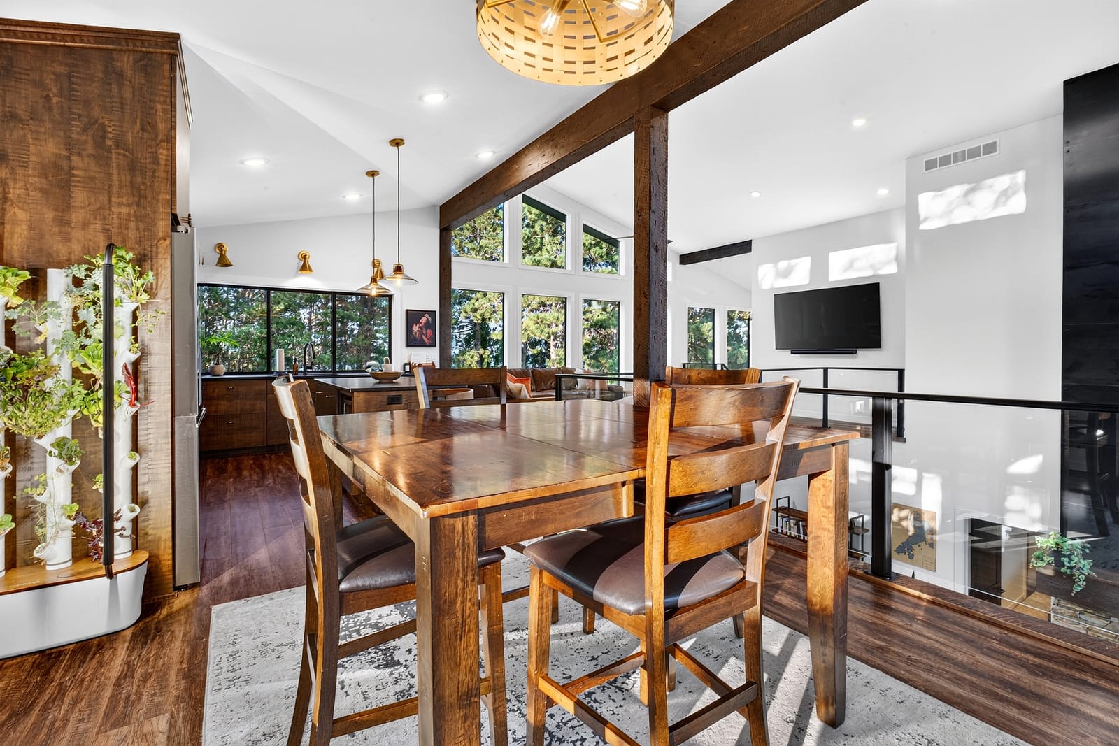 The dining table under the vault and its timber beams.