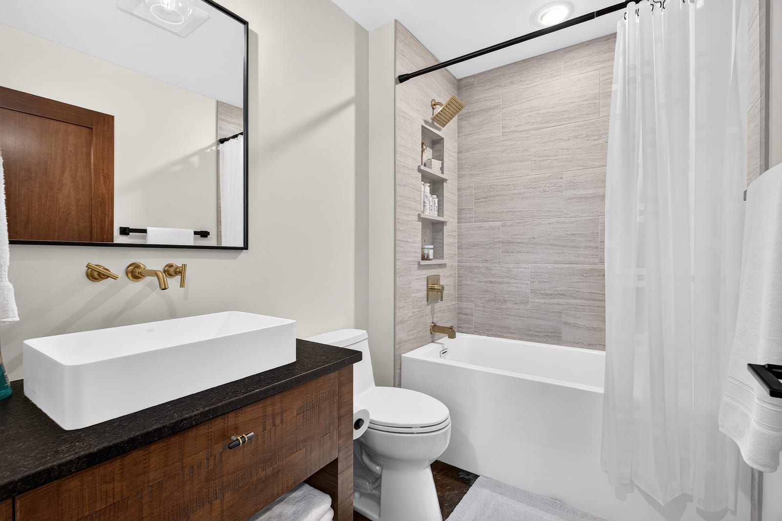A family bathroom with a tub and shower.